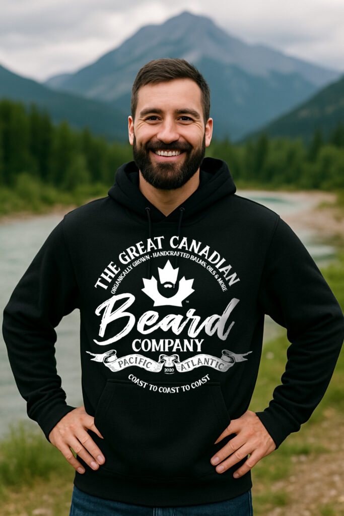 Black hoodie with The Great Canadian Beard Company® logo worn by a bearded man in an outdoors setting.