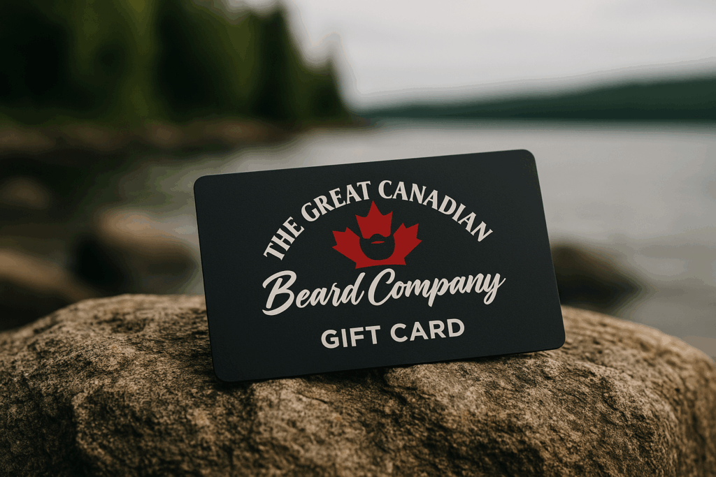 Great Canadian Beard Company® gift card placed on a rustic outdoor surface with a water and rock background.